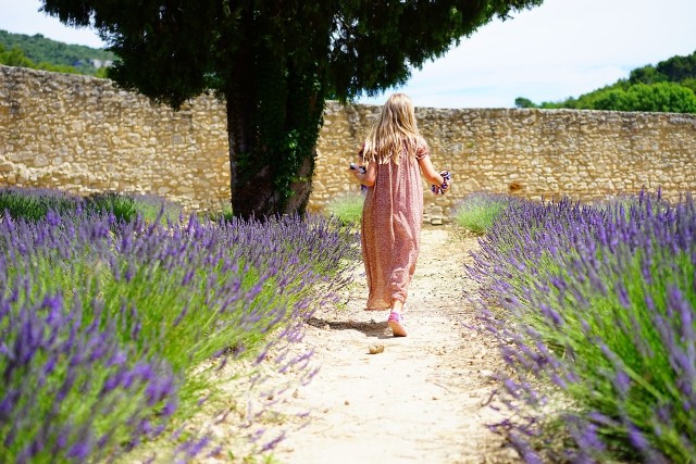 lady walking in crystal herbal garden